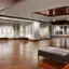 gymnasium flooring with nicely lit displays on the wall